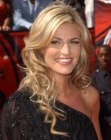 Erin Andrews wearing her hair long and styled into waves and curls