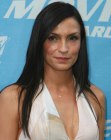Famke Janssen wearing her hair long with highly textured ends