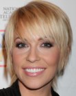 Farah Fath's blonde shaggy hairstyle with bangs
