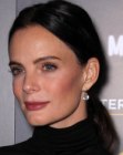 Gabrielle Anwar with her hair slicked back and styled in a ponytail