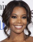 Gabrielle Union's up-style with curled strands of hair along the face