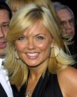 Geri Halliwell wearing shoulder length hair with feathered sides for a bouncy effect