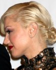Gwen Stefani with her hair styled into a low twisted bun