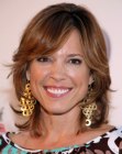 Hannah Storm sporting a mid-length shag haircut with smooth styling