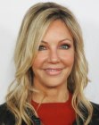 Heather Locklear's long hairstyle with curled ends