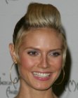 Heidi Klum wearing her hair in a high ponytail and with tightly pulled back sides