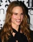 Hilary Swank wearing her long brown hair with angled up sides