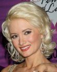 Holly Madison sporting a medium length shag with a retro appeal