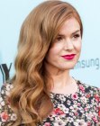 Isla Fisher sporting a long gatsby hairstyle with old-fashioned waves