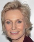 Jane Lynch's short hairstyle with layers and waves