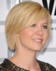 Jenna Elfman with short hair and side bangs