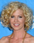 Jenna Elfman wearing her hair short with layers and ribbon curls