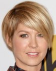 Jenna Elfman wearing her hair short in a blend of a bob and a pixie