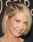 Jenna Elfman with her hair cut in bob that covers the neckline