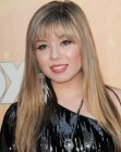 Jennette McCurdy wearing her long hair with soft alyers and wispy bangs