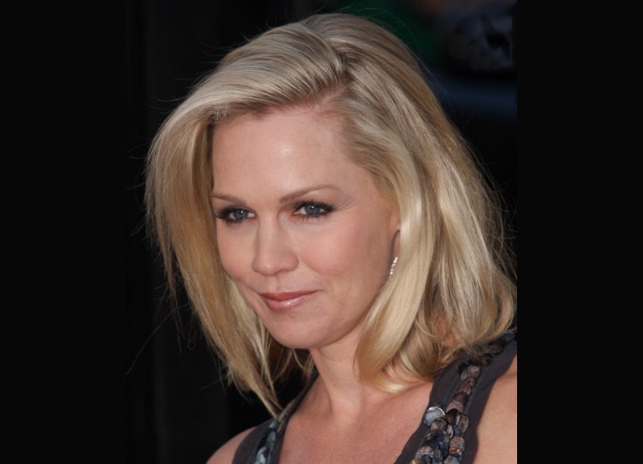 Jennie Garth with her hair styled to one side