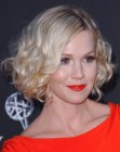 Jennie Garth wearing her hair short and curly