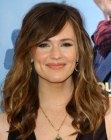 Jennifer Garner with her curled hair styled for a windblown effect