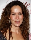 Jennifer Grey's curly hairstyle that keeps the forehead free of hair