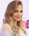 Jennifer Lopez wearing her hair in a comb over style with waves