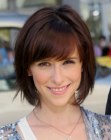 Jennifer Love Hewitt wearing her hair in a bob with bangs that frames her face