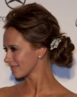 Jennifer Love Hewitt's elegant hairstyle with a curled chignon