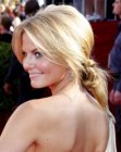 Jennifer Morrison with her hair styled into a knot with a ponytail