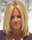 Jenny McCarthy rocking a long blonde bob with angled up sides
