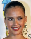 Jessica Alba's hair styled severely back from her face