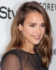 Jessica Alba's casual and comfortable long hairstyle with a side parting
