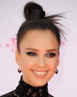 Jessica Alba's top knot up-style with fanning hair ends