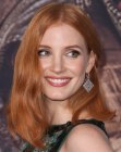 Jessica Chastain wearing her red hair in  a shoulder length style