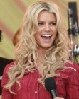 Jessica Simpson with her very long hair styled into waves and lazy curls
