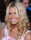 Jessica Simpson wearing her hair in naturally looking curls and waves