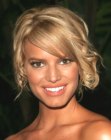 Jessica Simpson wearing her curly hair up with smooth bangs
