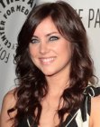 Jessica Stroup wearing her long hair curled away from the face