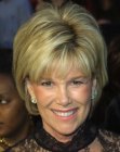 Joan Lunden sporting a short layered hairstyle with bounce