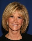 Joan Lunden wearing a neck length bob with styling for roundness