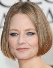Jodie Foster with her hair in a chin length bob featuring a middle part