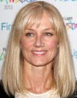 Joely Richardson with her hair cut into a shoulder length style with bangs that touch her eyebrows