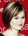 Julia Stiles with her hair cut short in a slanted bob