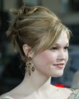 Julia Stiles with her hair styled up for a princess look