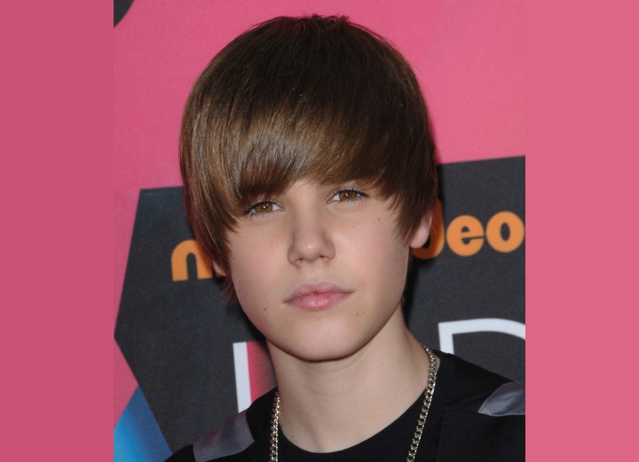 Justin Bieber with his hair cut in long layers