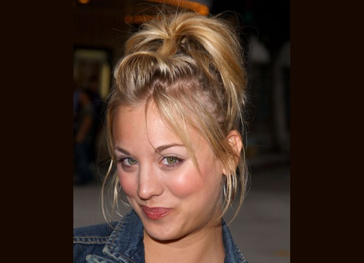 Kaley Cuoco with her hair up and styled with a top notch