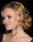Kate Bosworth's updo with loose piled curls