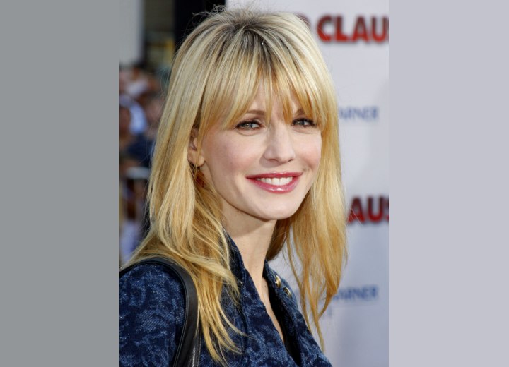 Kathryn Morris sporting an easy to maintain long hairstyle with a 