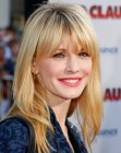 Kathryn Morris sporting a long and easy to maintain haircut with over the eyes bangs