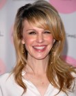 Kathryn Morris with long and bright golden blonde hair