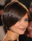 Katie Holmes with her hair cut in a bob that reveals her neckline