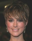 Keira Knightley sporting a short cropped haircut with bangs